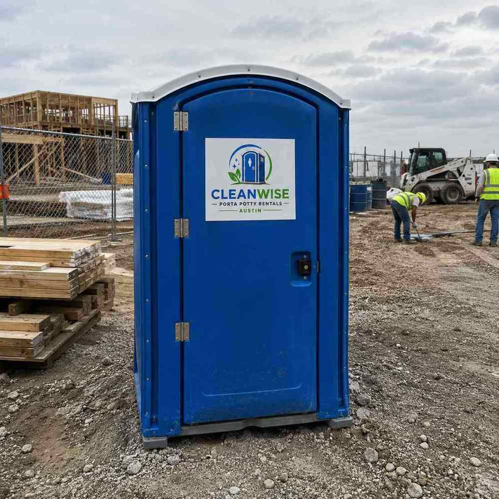 Standard porta potty rental unit on an Austin construction site