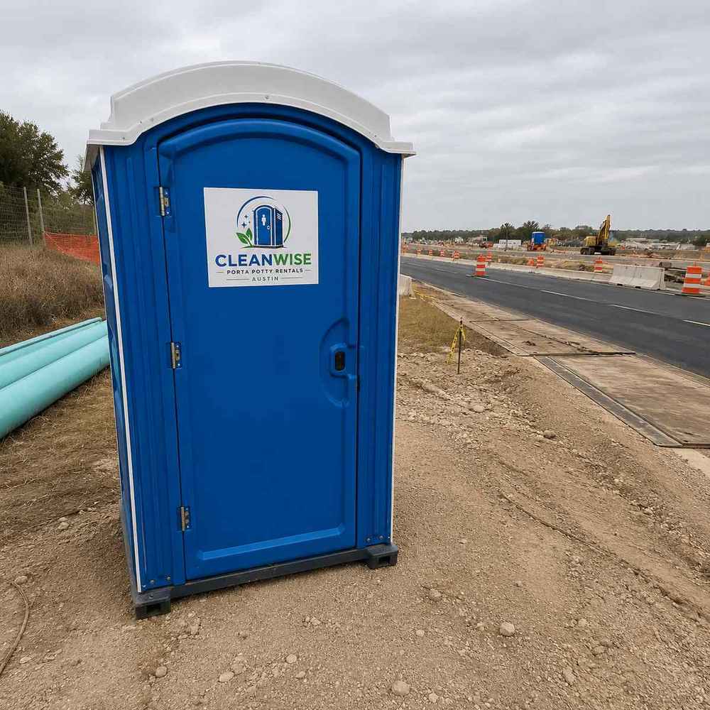 Construction porta potty rental at an Austin highway job site