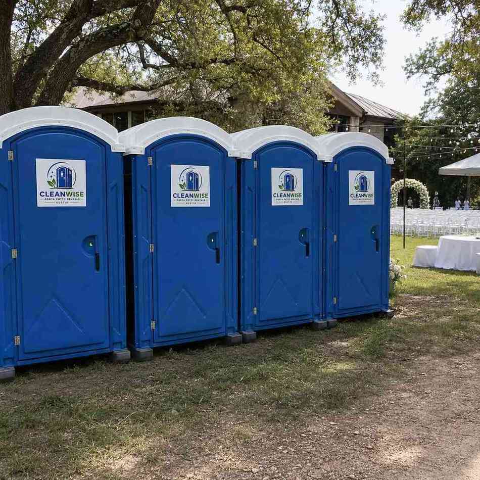 Event and wedding porta potty rentals lined up at an Austin venue